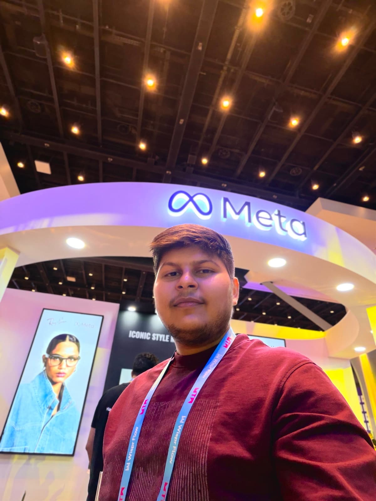 Meet Jariwala in front of the Meta stand at a technology conference
